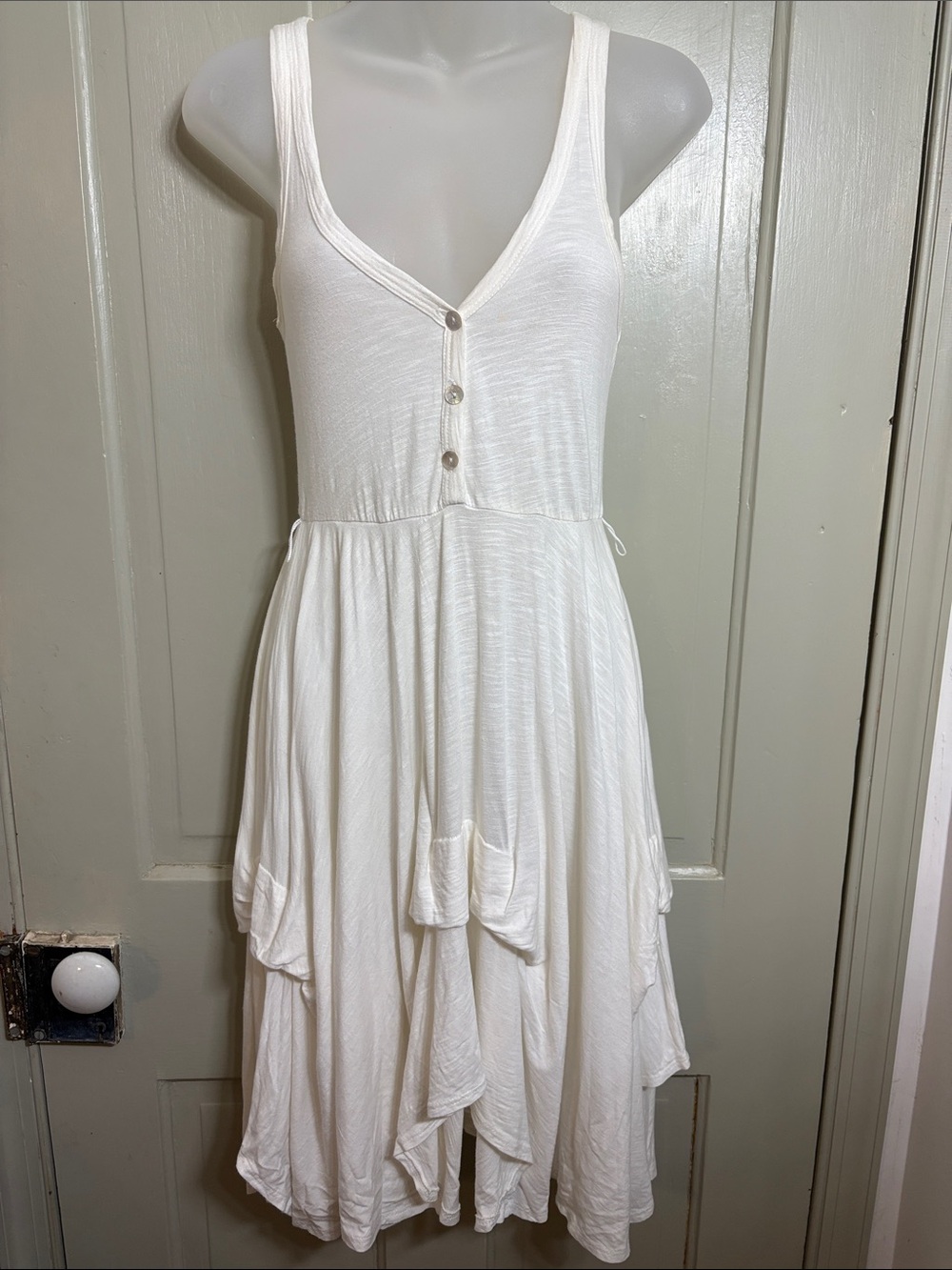 Puella Sleeveless White Asymmetrical Button-Front Handkerchief Hem Dress